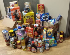 Image of grocery items like cereal and canned goods.