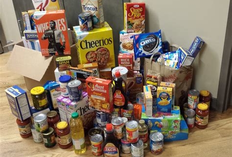 Image of grocery items like cereal and canned goods.