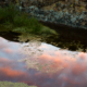 a reflective pond shows sunset. this image is near Vasco Caves Regional Preserve in Co Co County